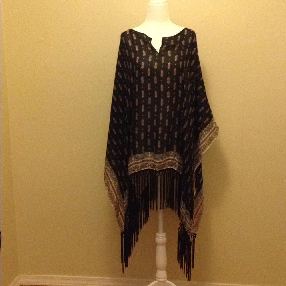 Maurice's poncho. Paisley print. Black fringe.